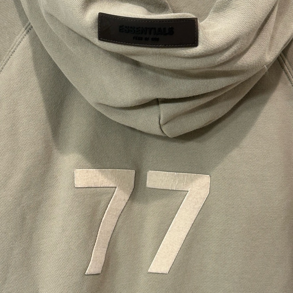 Fear of God Essentials Women's 3/4 Sleeve Hoodie w/ a 77' graphic on the back